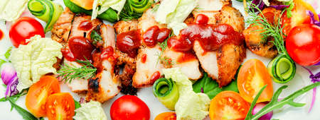 Salad with tomato, cucumber, lettuce and meat steak. Sliced grilled steakの写真素材