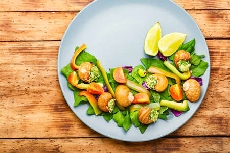 Salad with snails, spinach, tomato and pepper.Healthy vegetable saladの写真素材