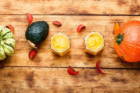 Healthy pumpkin smoothie on rustic wooden backgroundの写真素材