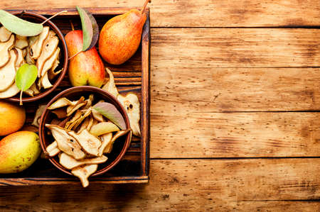 Sliced dried pear pieces. Dried pear or pear chips.Copy spaceの写真素材