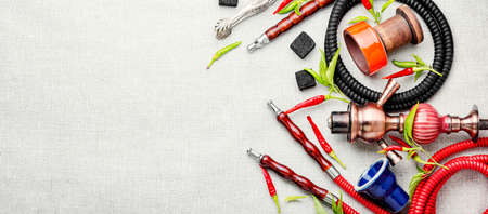 Oriental hookah with tobacco aroma of red hot pepper. Hookah with chilli pepper flavor.Copy space