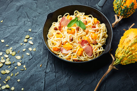 Autumn menu, pasta with pumpkin and bacon.Pasta carbonara.Pasta with baked pumpkinの写真素材