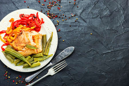 Fish grenadier baked with vegetables.Flat lay with copy space