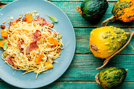 Autumn menu, pasta with pumpkin and bacon.Pasta carbonara.Pasta with baked pumpkinの写真素材