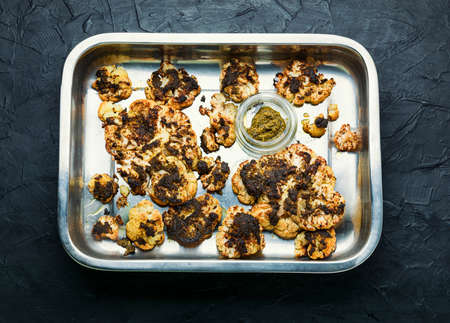 Vegetarian cauliflower steak in tray.Grilled cauliflower vegan.の写真素材