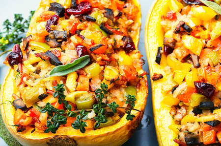 Baked pumpkin stuffed with rice and vegetables.の写真素材