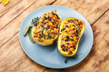 Baked pumpkin stuffed with rice and vegetables. Rice with vegetable in a pumpkinの写真素材