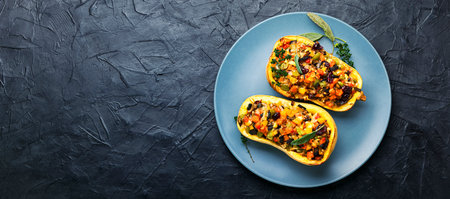 Baked pumpkin squash with rice and vegetables.Rice with vegetable in a pumpkin.Space for textの写真素材