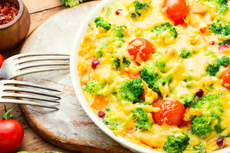 Vegetable casserole with broccoli, tomato and pumpkin. Vegetarian vegetable casseroleの写真素材