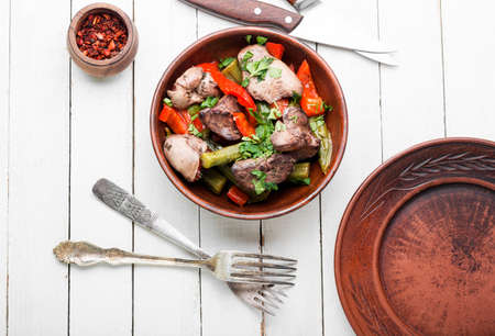 Salad with liver, bell pepper, okra and herbs. Chicken liver saladの写真素材