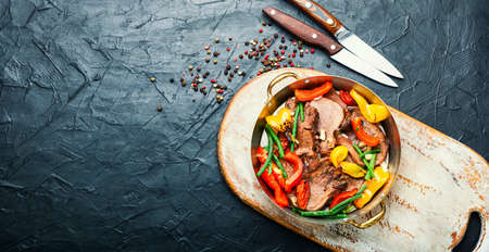 Boiled beef tongue with bell pepper.Sliced beef tongue.Space for textの写真素材