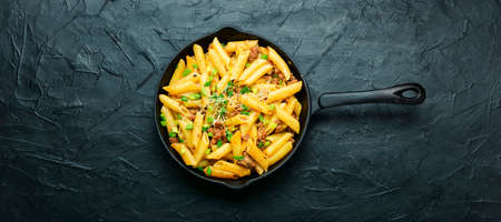 Skillet of pasta with fried minced meat.の写真素材