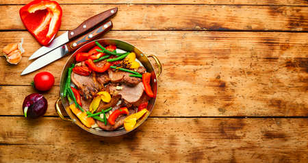 Appetizing boiled beef tongue with bell pepper.Space for textの写真素材