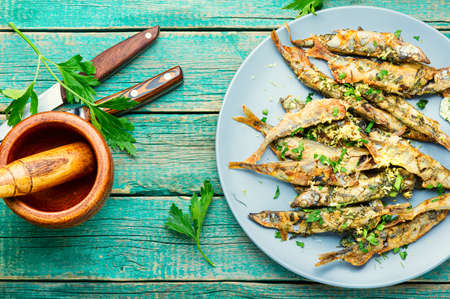 Roasted capelin fish with herbs and lemon zest.Fish dishの写真素材