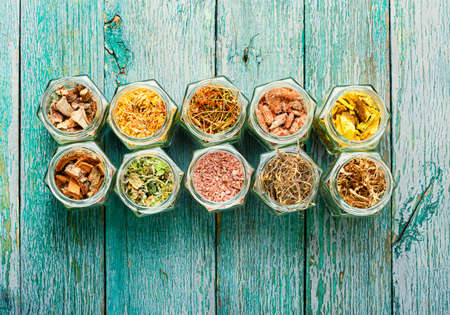 Set of dry medicinal herbs in glass jars.Alternative medicine concept or herbal medicineの写真素材