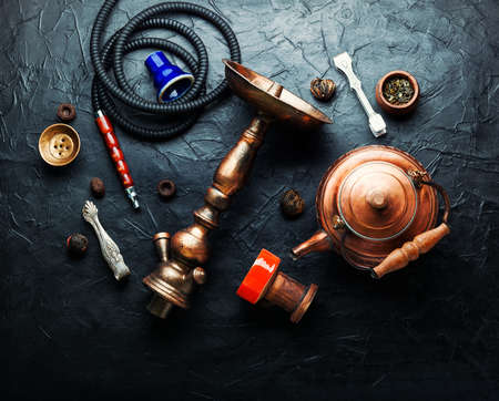 Aroma of an oriental smoking hookah with tea.Making hookah for smokingの写真素材