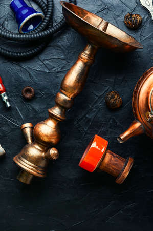 Aroma of an oriental smoking hookah with tea.Making a smoking shisha