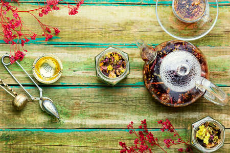 Healthy flower tea in a glass teapot.Natural herbs medicineの写真素材