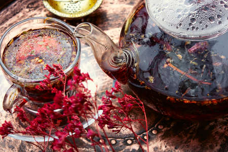 Fragrant flower tea in a glass teapotの写真素材