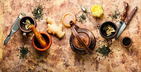 Teapot with tea made from ginger, honey and lemon.Vitamin, healing teaの写真素材