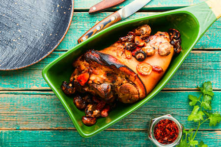 German food meat dish of pork knuckle in baking dish. Braised pork legの写真素材