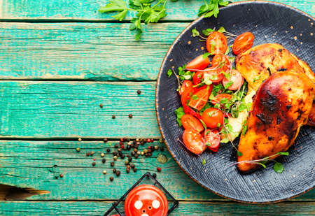 Chicken fillet with vegetable salad.Chicken breast on plate.Healthy food.Space for textの写真素材