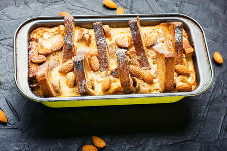 Dessert of toast bread, cottage cheese, banana and nuts.Homemade toasts cake for breakfast.French...