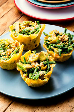 Appetizing cheese basket with avocado, cowpea and nuts. Banquet, holiday food
