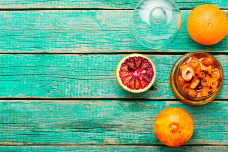 Delicious orange jam on wooden table. Orange jam in a glass jarの写真素材