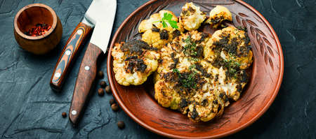 Vegetarian cauliflower steak.Grilled cauliflower vegan on plate.Vegetarian foodの写真素材