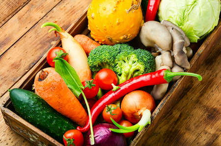 Fresh raw vegetables on the kitchen table.Healthy eating conceptの写真素材