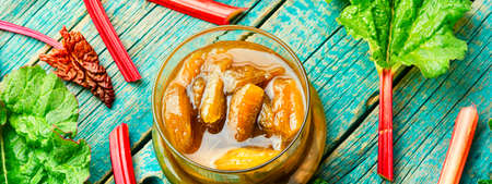Fresh rhubarb jam in glass bowl.Natural vegetable jam on wooden backgroundの写真素材
