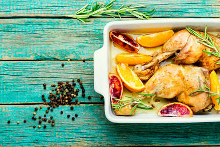 Grilled chicken meat with orange sauce and rosemary.Homemade food.Space for textの写真素材