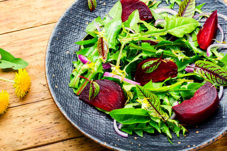 Green vegetarian salad made from beets and greens.Vegan menu.