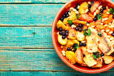 Oriental dessert made from baked fruits, berries and suluguni cheeseの写真素材