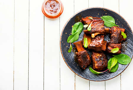 Tasty BBQ beef ribs seasoned with spicy sauceの写真素材