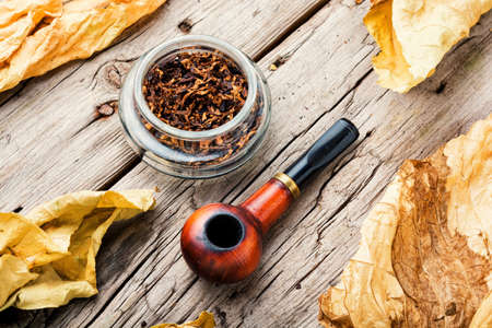 Vintage tobacco pipe, tobacco leaf and pipe tobaccoの写真素材
