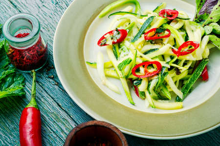 Summer salad of fresh zucchini, peppers and garlic.Vegetable saladの写真素材