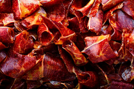 Sliced basturma or meat jerky.Beef jerky, dried beef.Armenian food.Food backgroundの写真素材