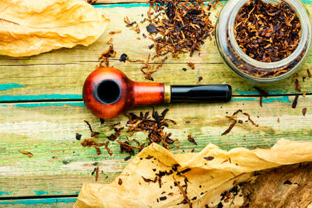 Vintage tobacco pipe, tobacco leaf and pipe tobaccoの写真素材