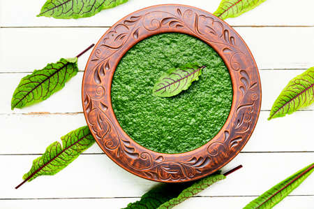 Homemade green sorrel soup. Green vegetable cream soup