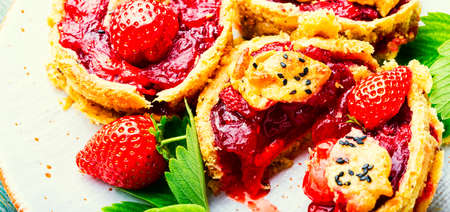 Yummy tartlets with berry jam.Cake with strawberries.Fruit dessertの写真素材