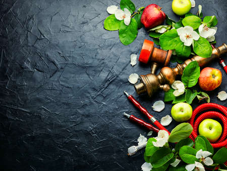Oriental hookah with the aroma of fresh apples. Floral shisha tobacco.Cooking hookah.Copy space