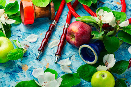 Oriental hookah with the aroma of fresh apples. Floral shisha tobacco.Cooking hookahの写真素材