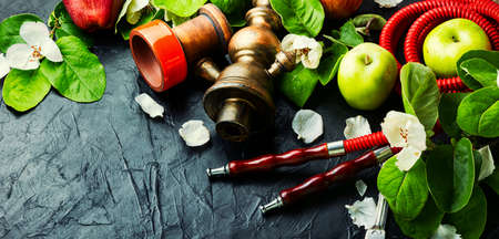 Hookah shisha with fruit tobacco. Hookah with apple tobacco. Kalian fresh fruit taste.の写真素材