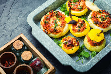 Squash stuffed with couscous and mushrooms. Baked patisson with shakshuka.Patty pan squashの写真素材