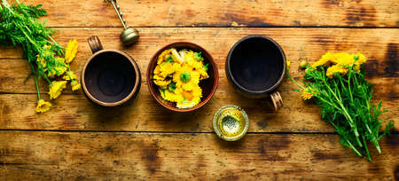 Healing flower tea. Teapot with chrysanthemum flower tea. Herbal medicine. Herbal tea.の写真素材
