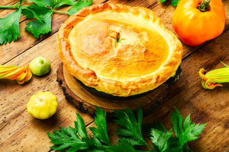 Rustic closed vegetable pie. Pie with zucchini and squash.の写真素材