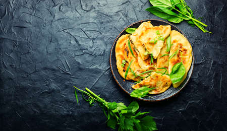 Azeyrbajan pie stuffed with fresh herbs. Qutabs or kutab. Copy spaceの写真素材