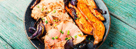 Sliced pieces of baked meat with yam.Roasted pork ham, slicedの写真素材